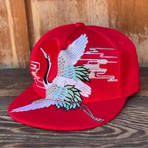 Embroidered crane snap back trucker hat